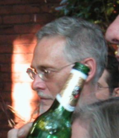 john hiding behind the bottle