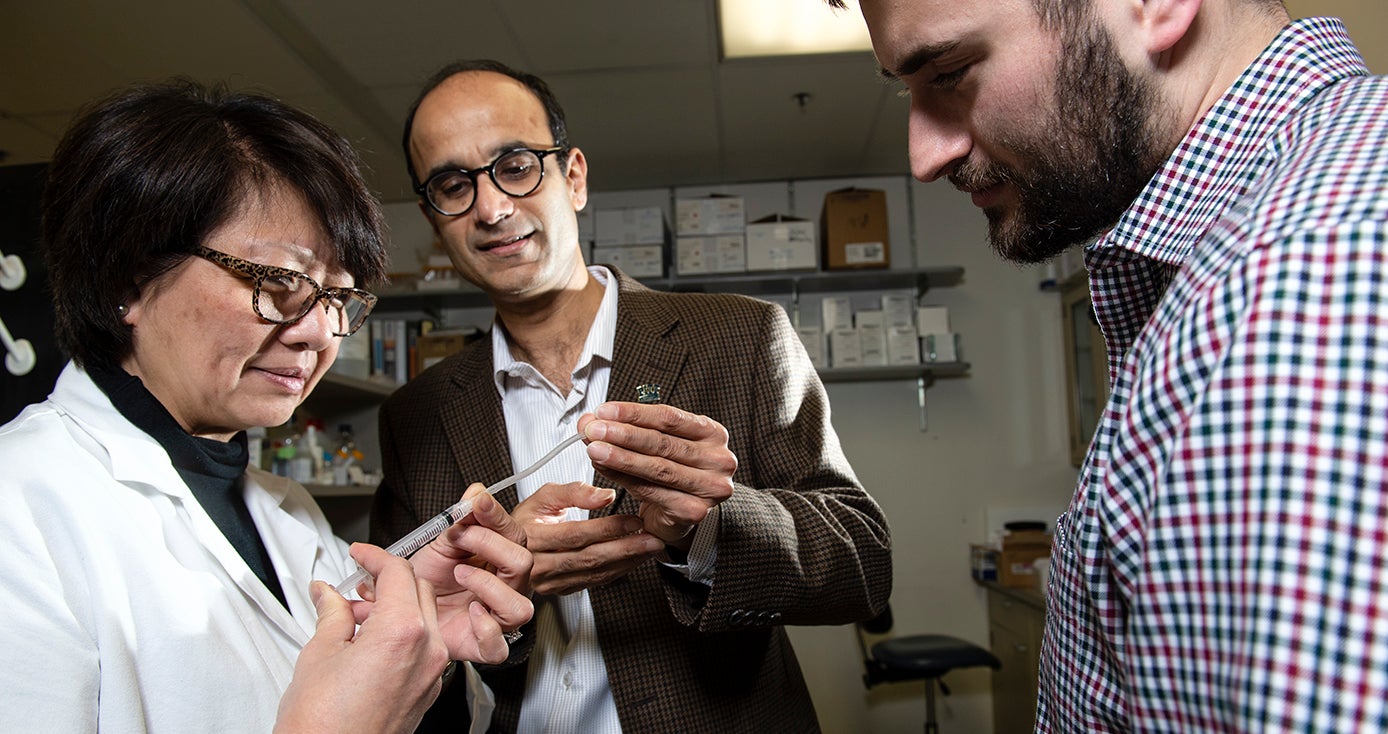 Edith Tzeng, professor of surgery in the School of Medicine; chemical engineering faculty member Sachin Velankar; and Pitt chemical engineering graduate Joe Pugar, with synthetic vascular graft device.