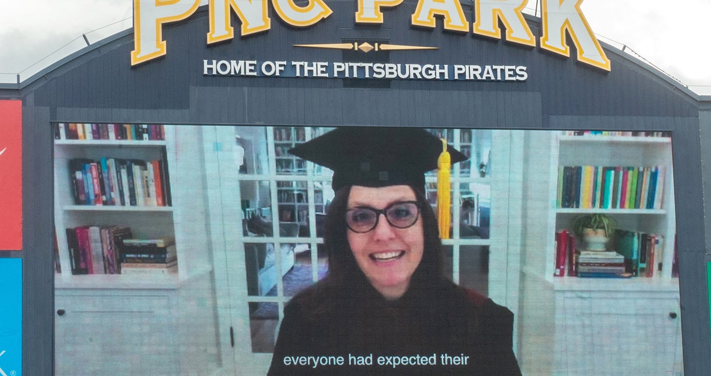 Rebecca Skloot in graduation gown on the PNC Park Screen