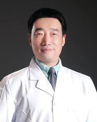Zhiyong Peng in a white coat and a light blue shirt with a tie