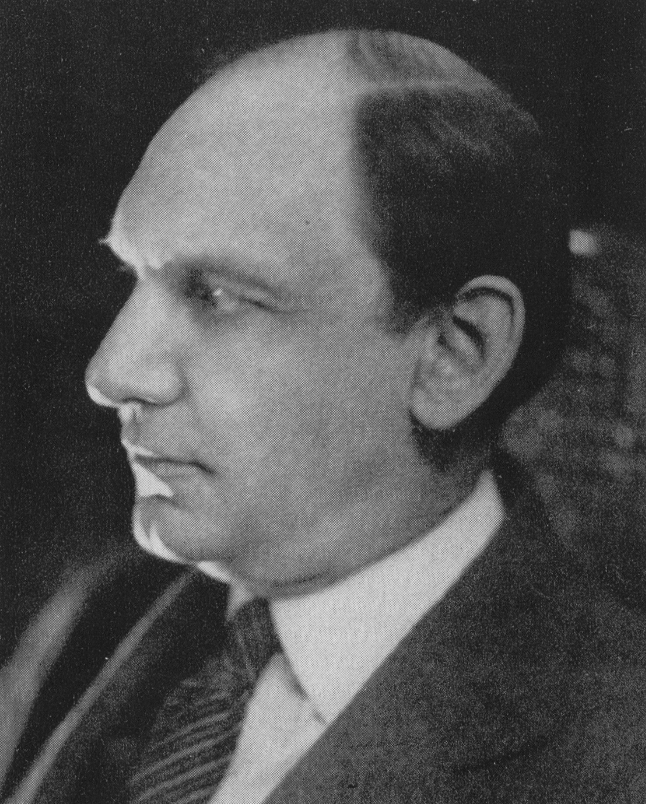 black and white profile image of Klauder in a suit