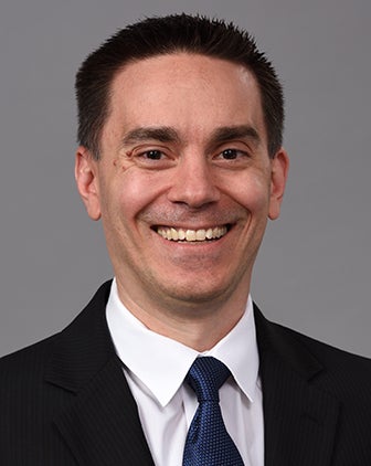 David Lebel in a black suit and dark blue tie