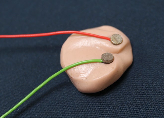 an earbud with wires attached to it