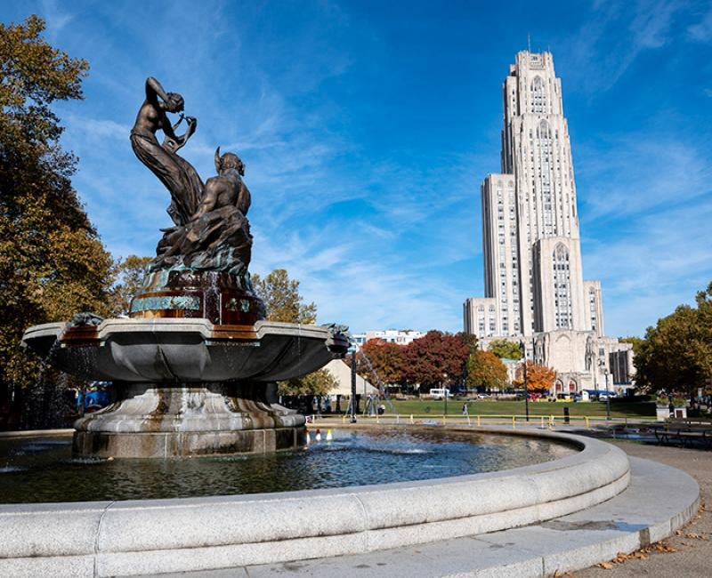 A fountain with bronze sculptures on Pitt's campus in front of the Cathedral of Learning