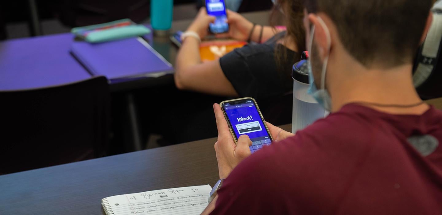 Students using smartphones at desks