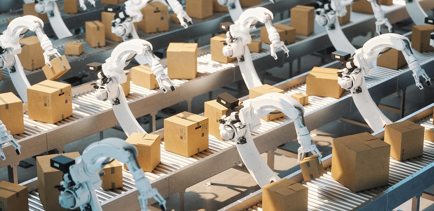 Factory line of robots moving boxes