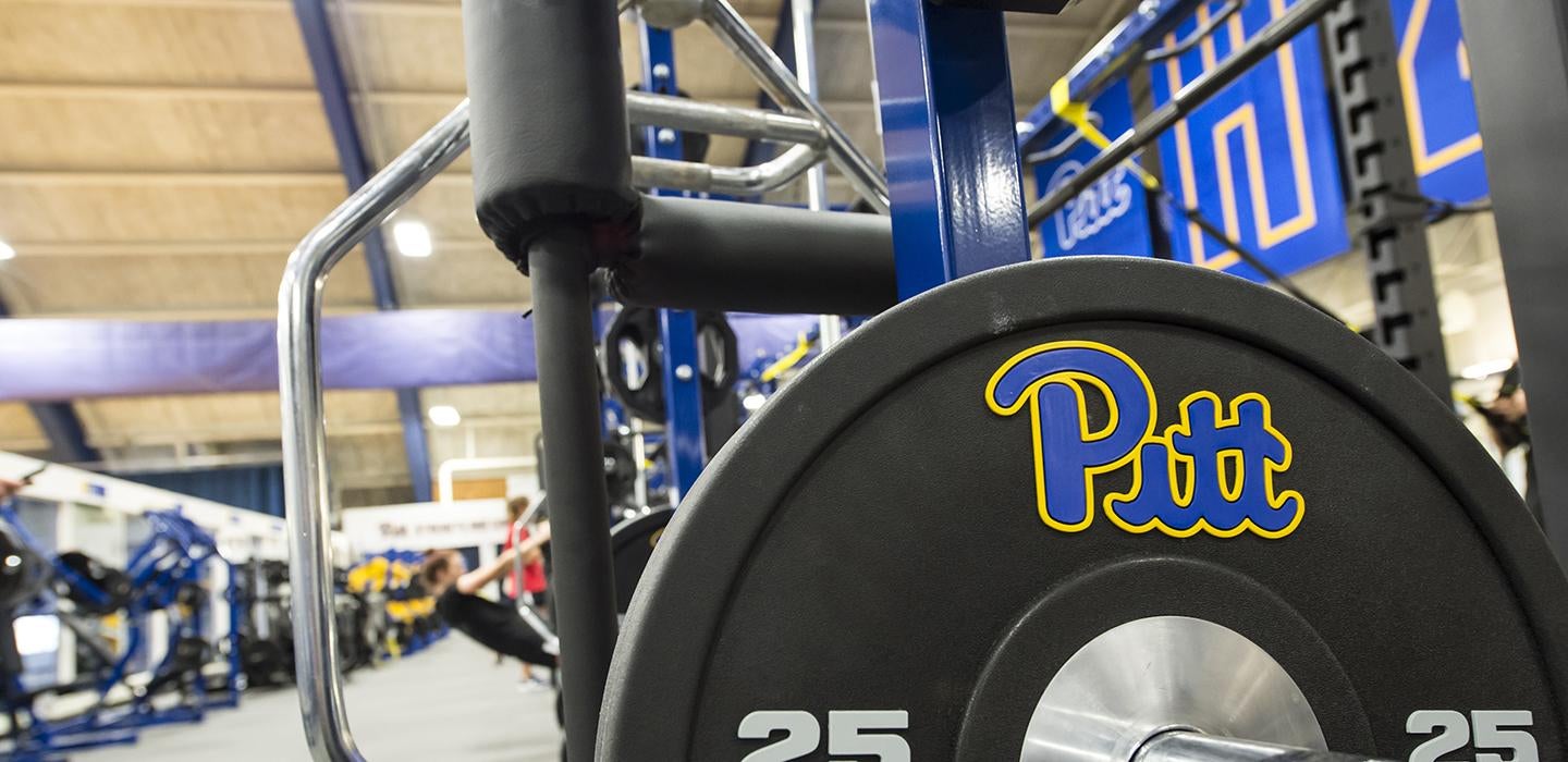 25-pound weight plate with Pitt logo in a gym 