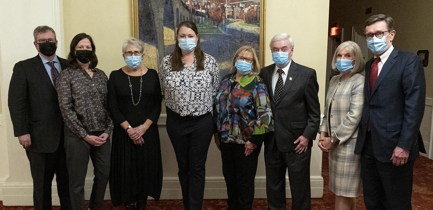Awardees and ARCS members wearing masks indoors and posing for group photo