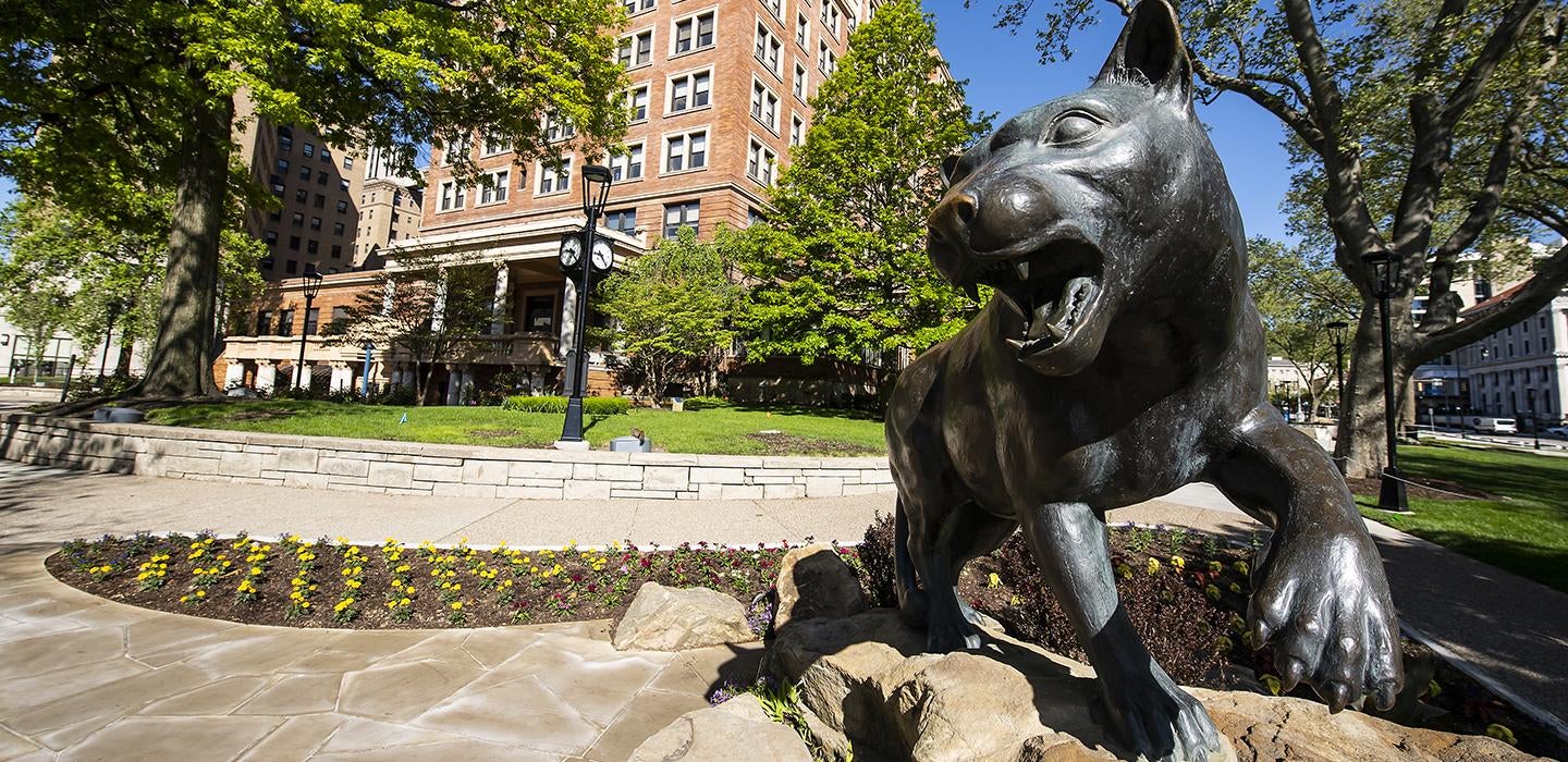 Panther statue on Pitt campus during a sunny day