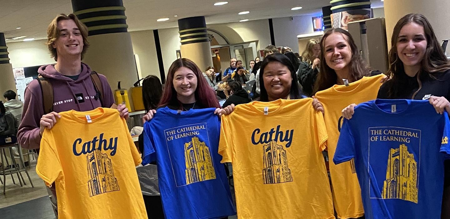 5 students holding Cathy or Cathedral shirts