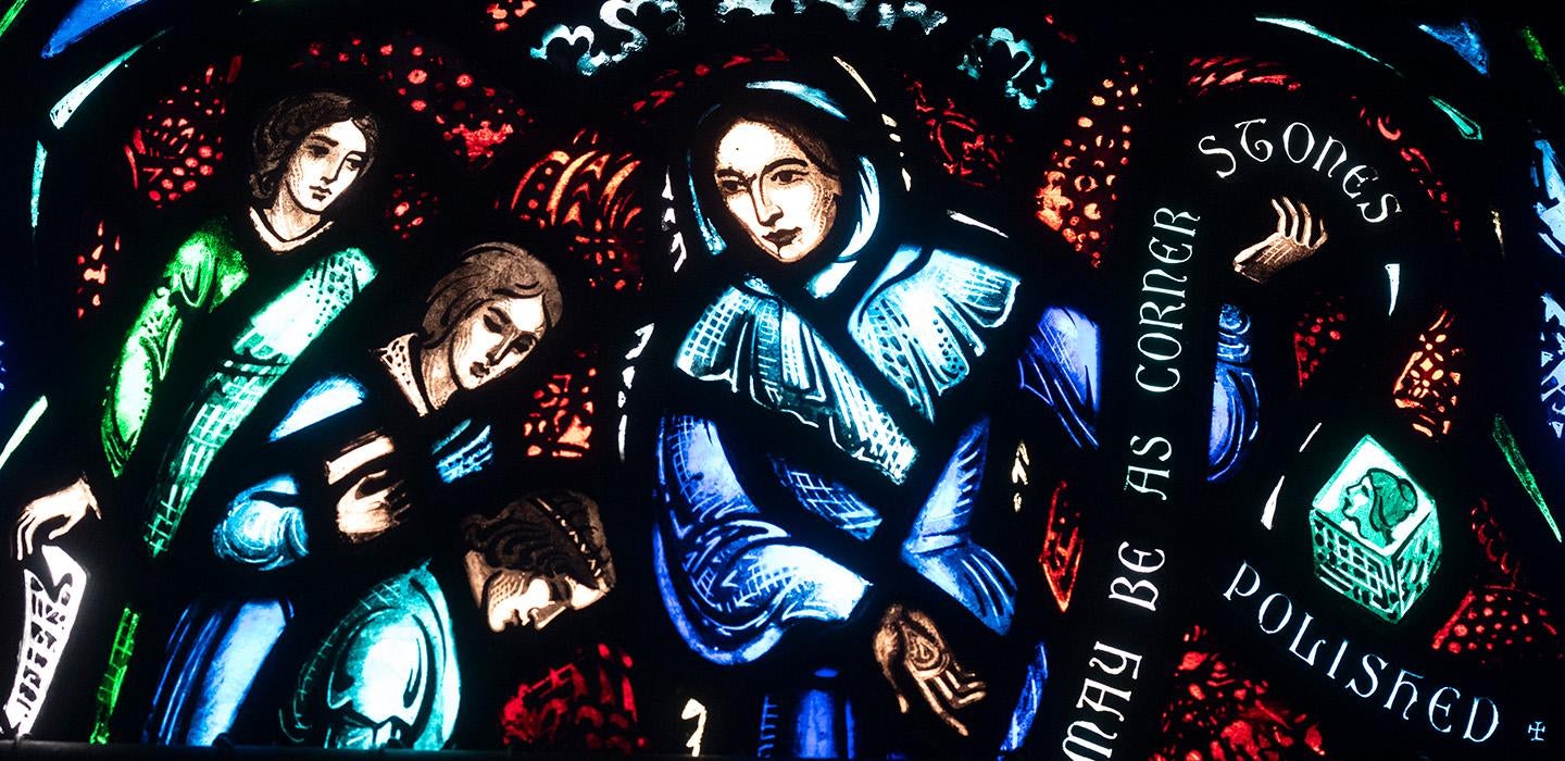 Stained glass windows featuring three women