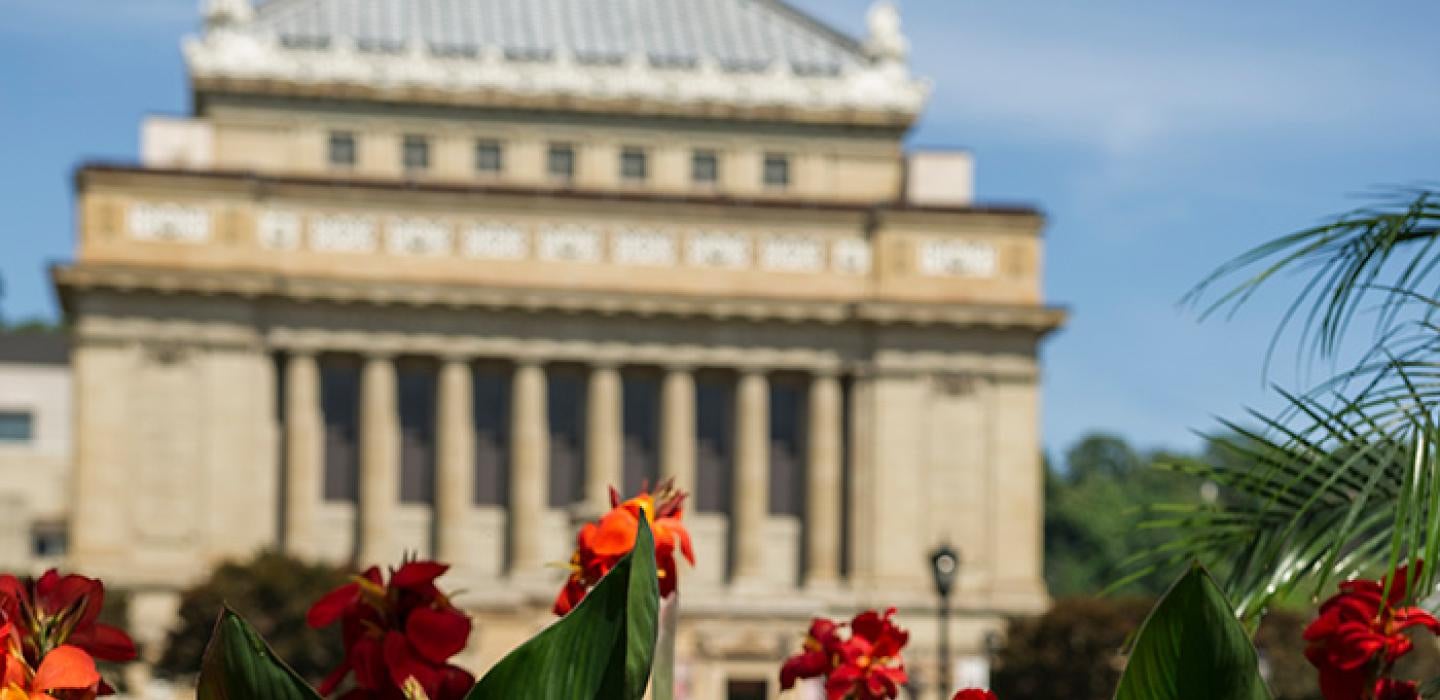 Red flowers in front of Soldiers and Sailors Memorial Hall