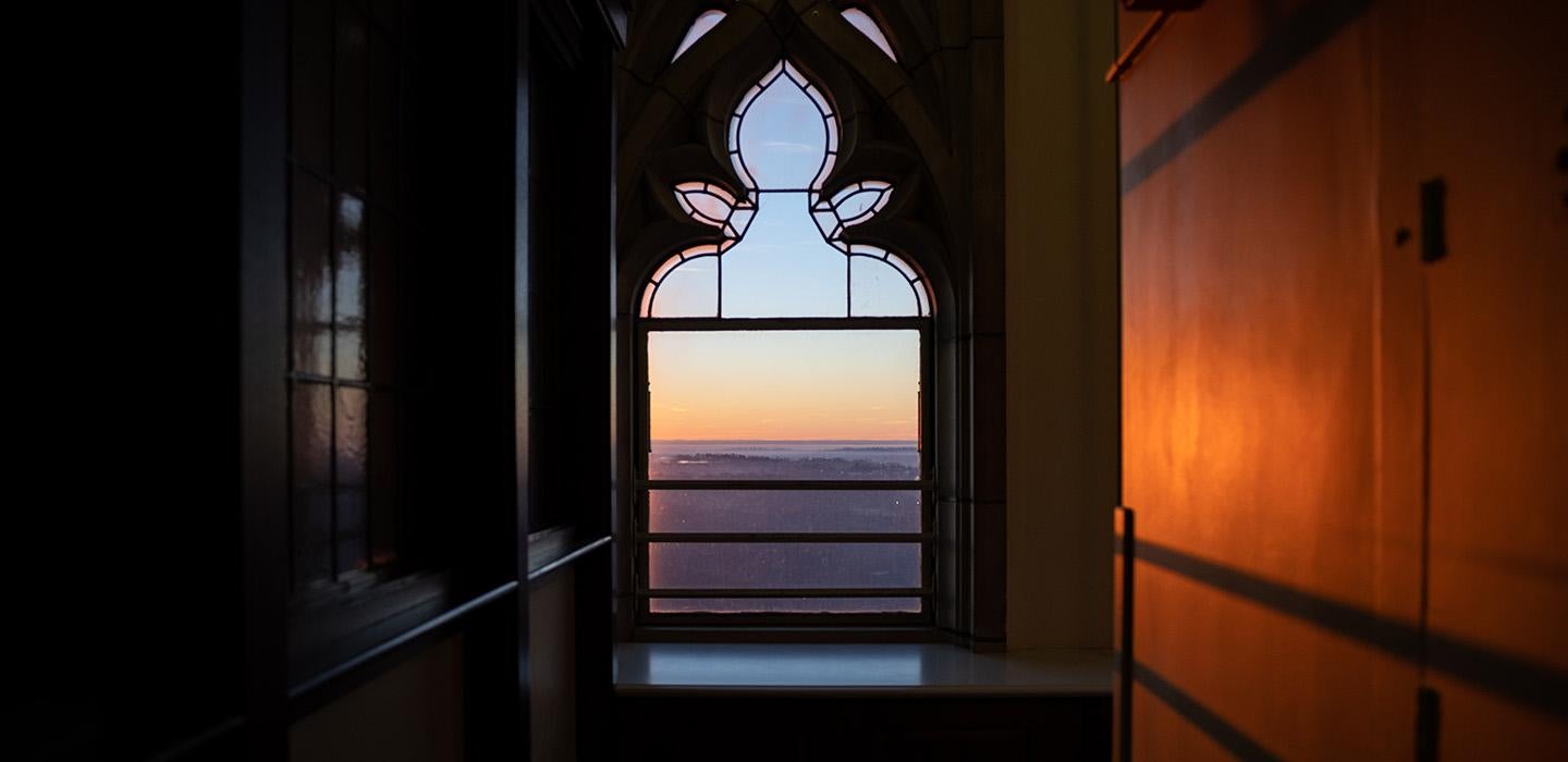 The sunsets through a window