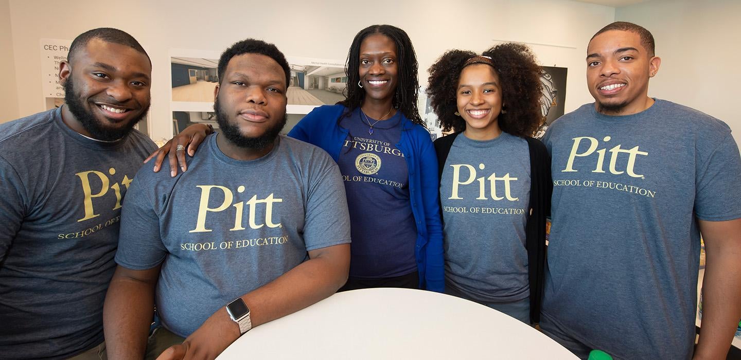 Kinloch with students in Pitt School of Education shirts