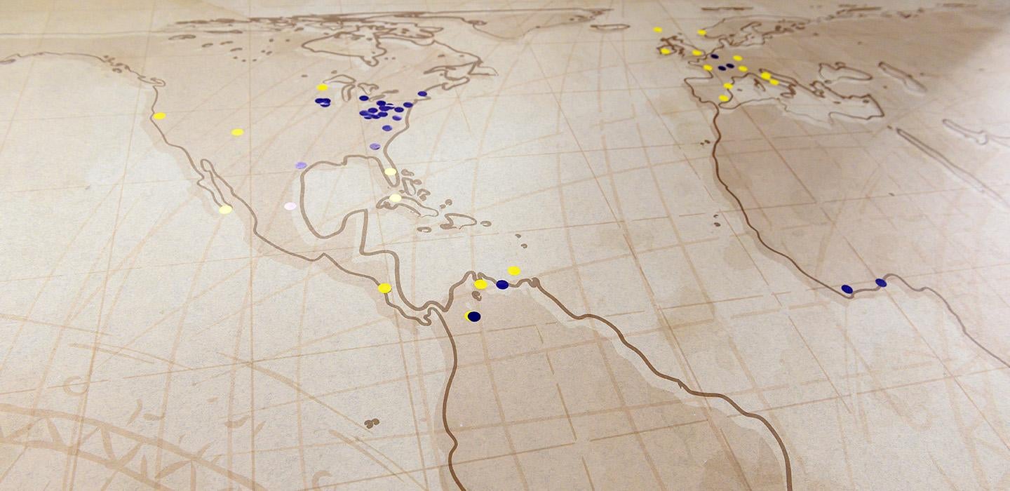 Blue and yellow dots on a world map