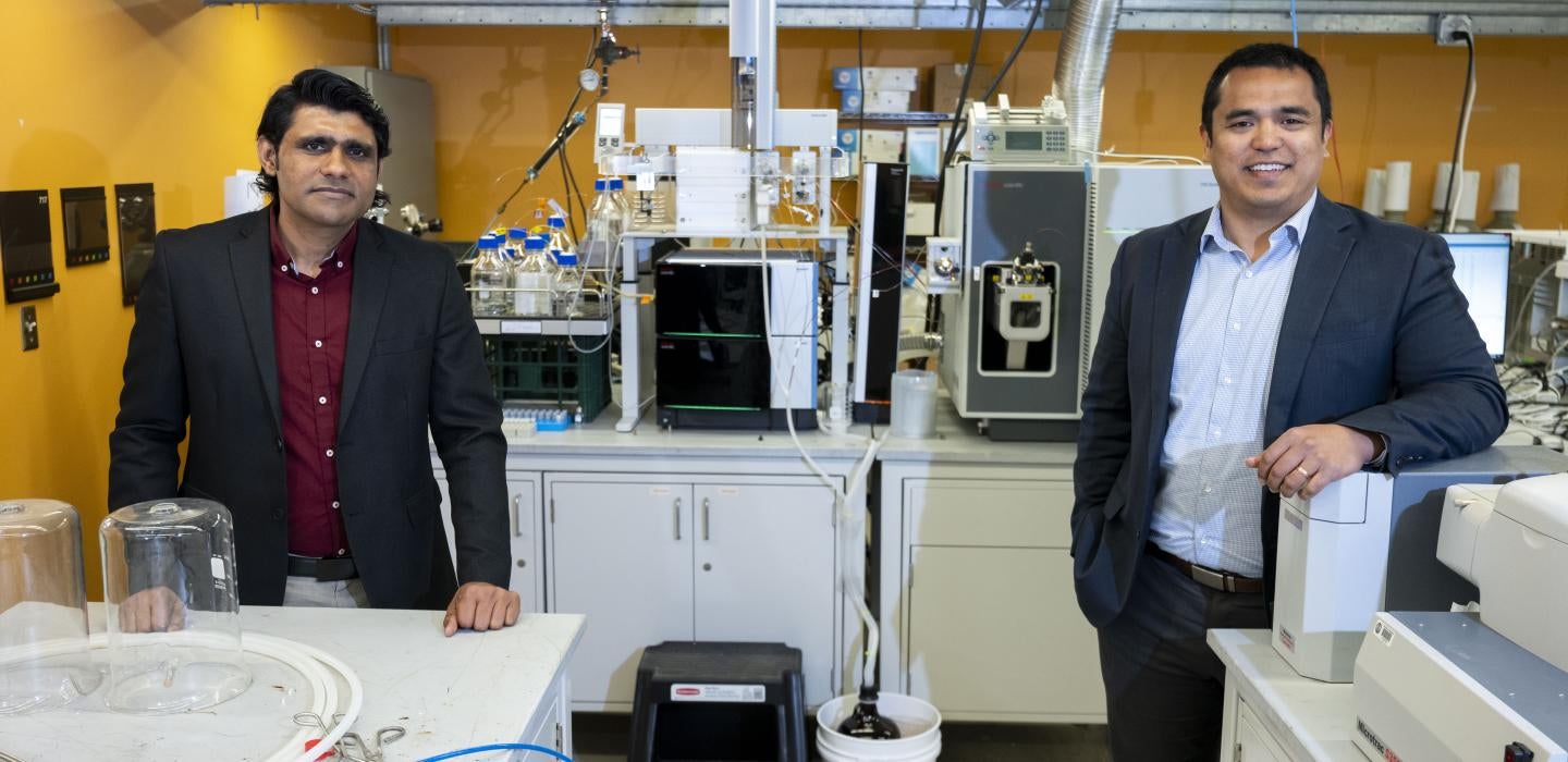 Left to right, Sustainable Design Labs researchers Hassan Nawaz and David Sanchez pose for a portrait in their lab.