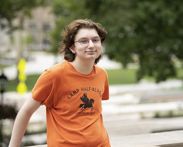 Nikolai Czepiel smiling with orange t shirt