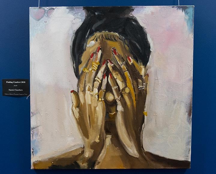 Painting of woman covering face with hands