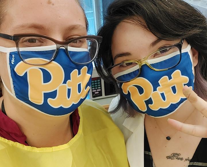 Maria D.H. Alcorn and Dominique J. Barbeau wearing Pitt masks