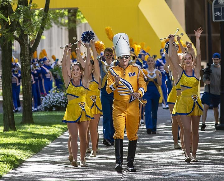 Pitt Band marching through campus after football victory