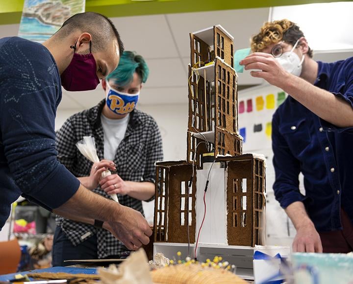 Pitt students building gingerbread Cathedral of Learning