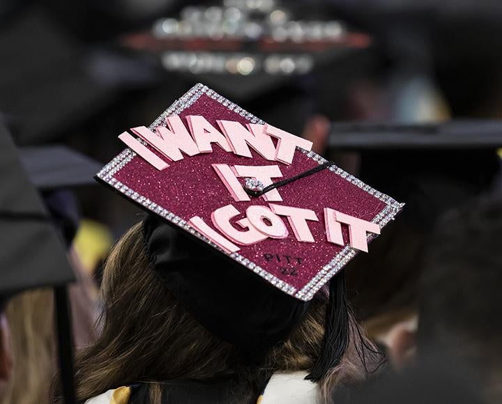 Decorated graduation cap that says, "I Want it I got it"