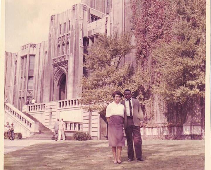 Henderson stands with his wife, Bebe, outside of the Cathedral of Learning