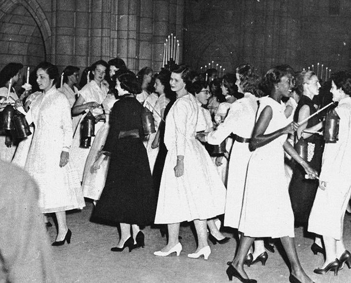 a black and white image of women gathered in the Cathedral for Lantern Night