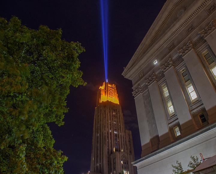 a blue light blasting from a gold-lit Cathedral