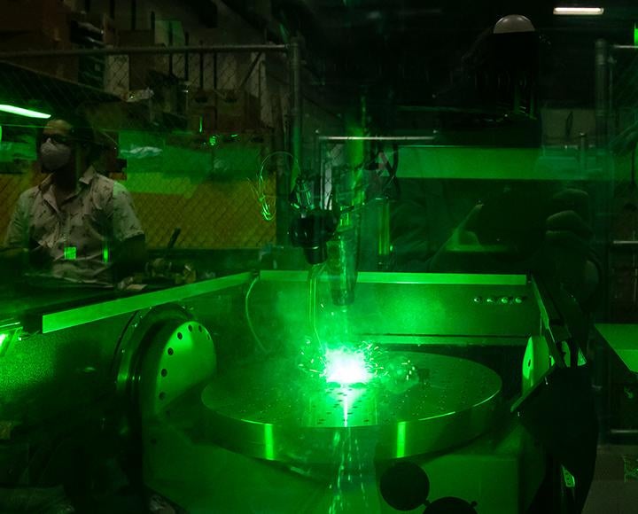 the machine working under glowing green light