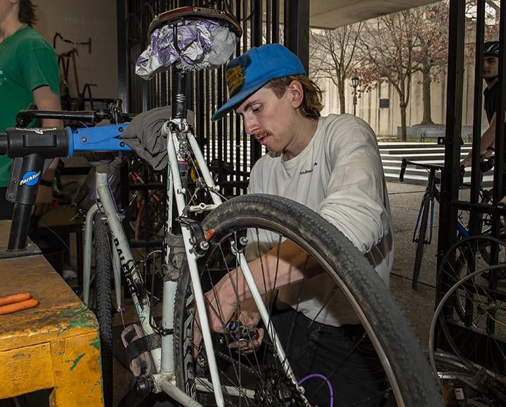 a person fixing a bike