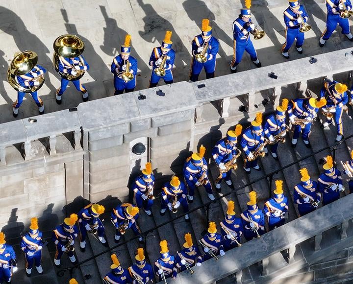 The Pitt Band plays on the steps of the Cathedral of Learning