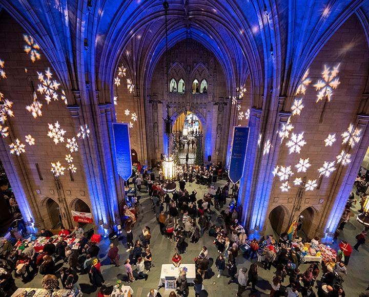 Snowflakes are projected onto the walls of the commons room in the Cathedral of Learning