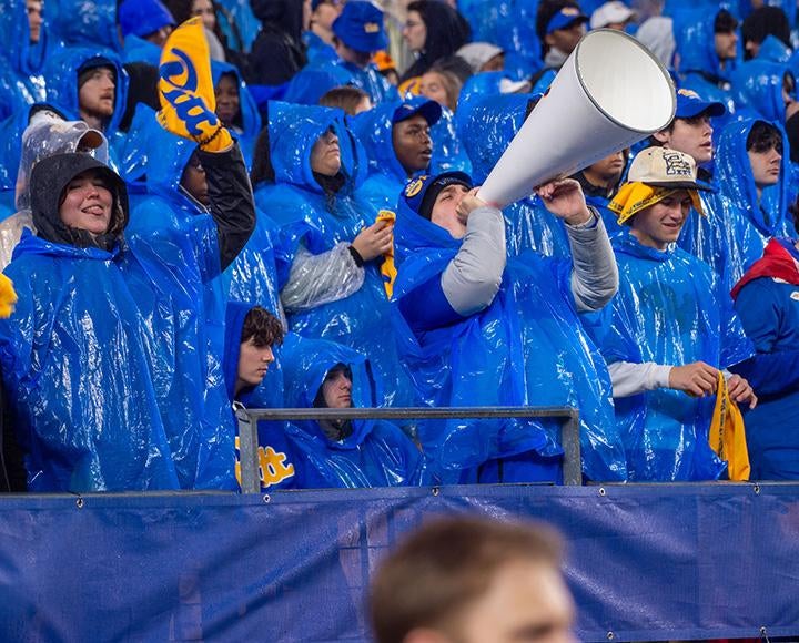 A crowd of Pitt fans in ponchos at Acrisure Stadium