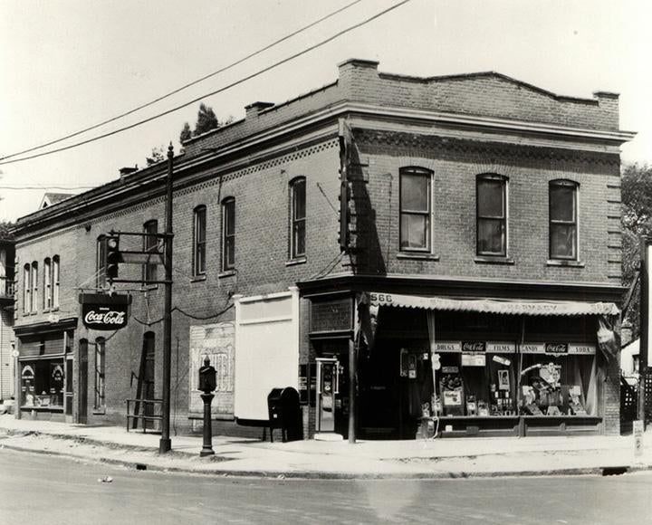 A black and white photo of a pharmacy building