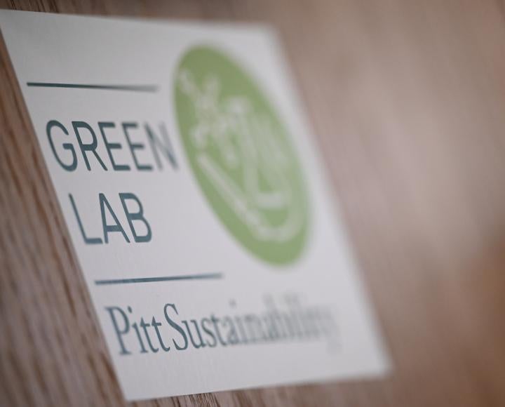 A sticker that reads "Green Lab, Pitt Sustainability"