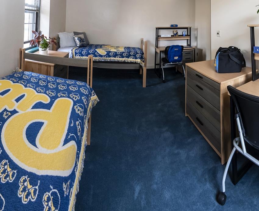 Pitt dorm room with two desks and two beds