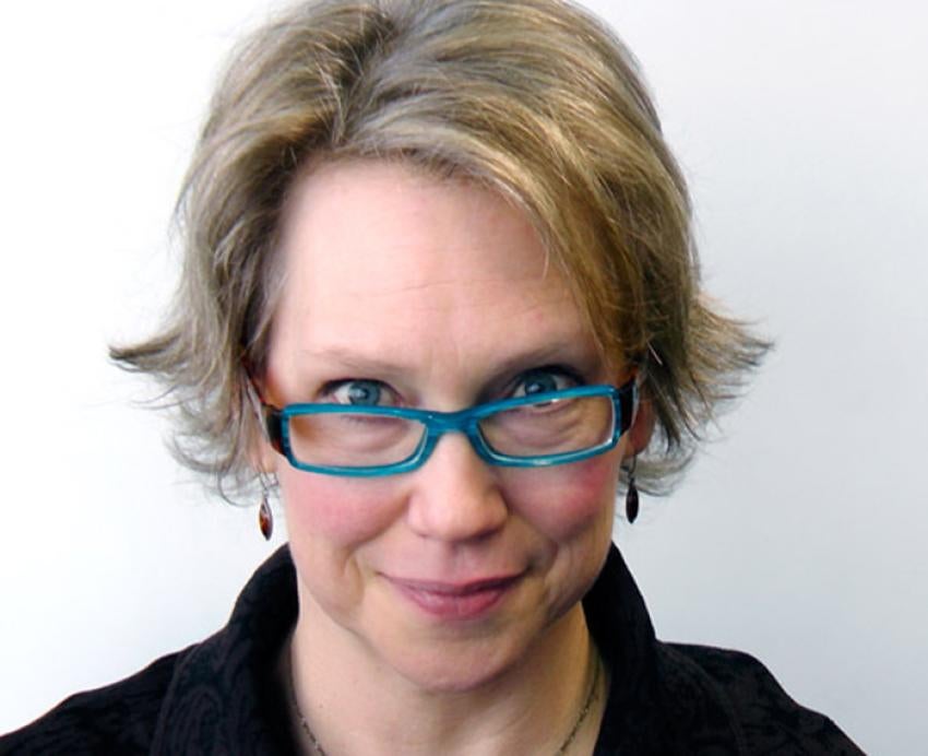 Valerie Fulmer wearing glasses with blue frames