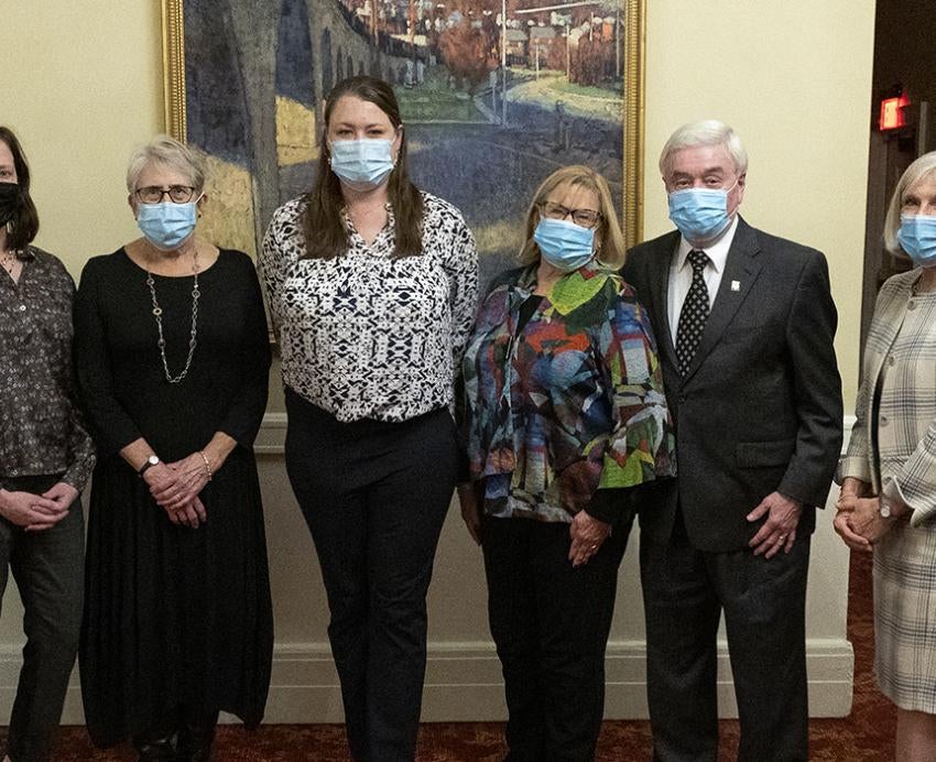 Awardees and ARCS members wearing masks indoors and posing for group photo