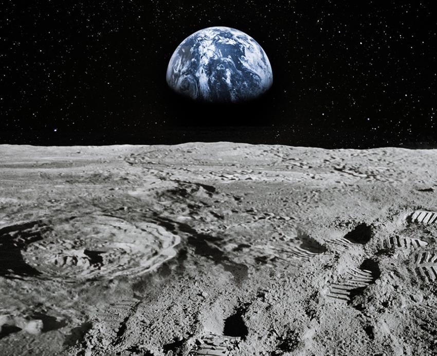 The moon's surface with the Earth in the background
