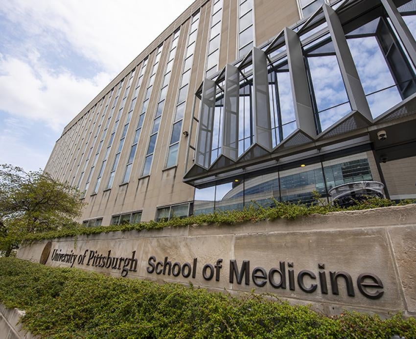 Scaife Hall exterior with School of Medicine sign