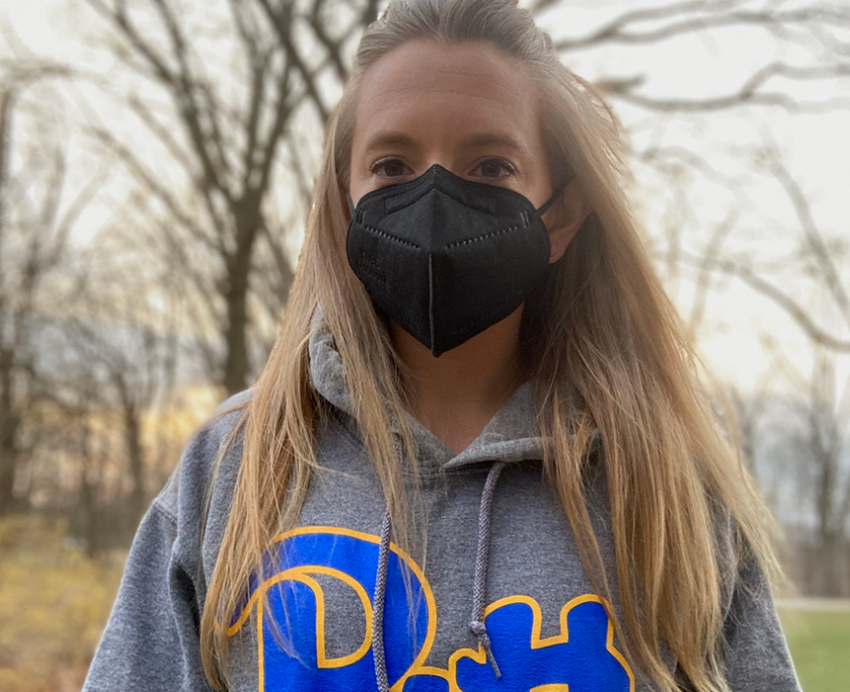 Cary Anderson wearing face mask and grey Pitt hoodie outside