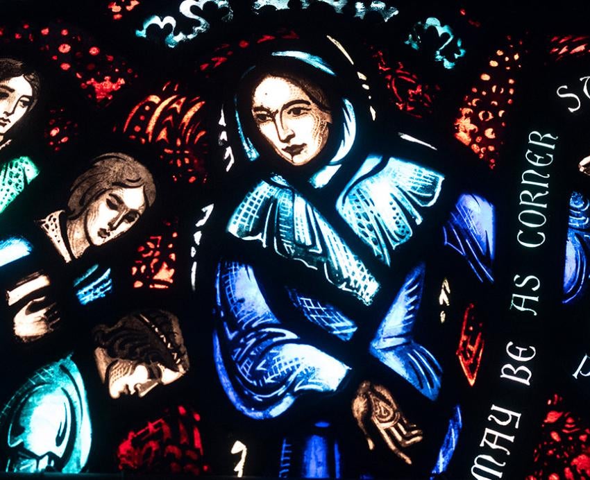 Stained glass windows featuring three women