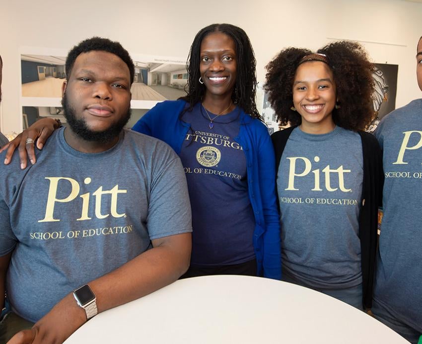 Kinloch with students in Pitt School of Education shirts