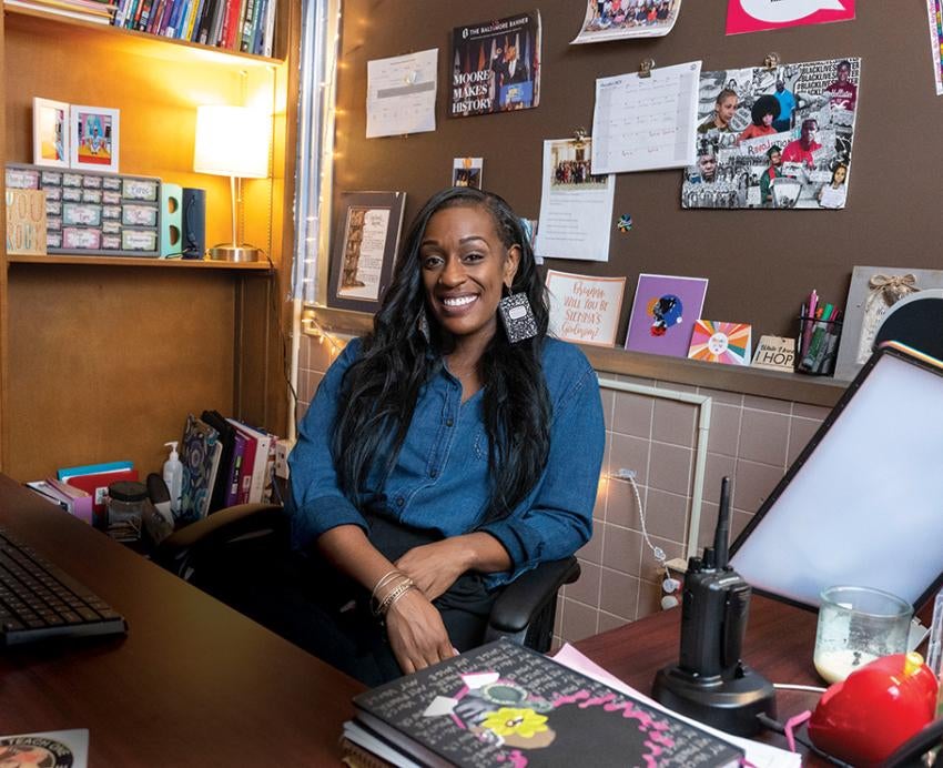Brianna Ross at her office desk