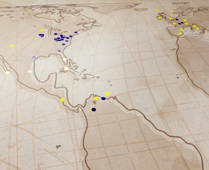 Blue and yellow dots on a world map