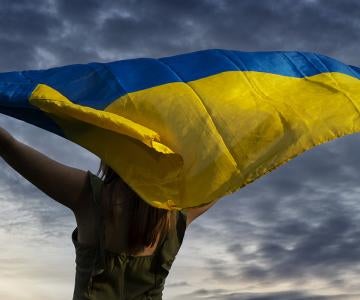Woman holding Ukraine flag 