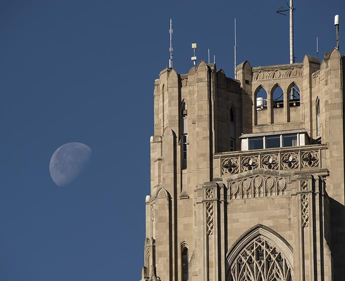 Cathedral of Learning with moon in background