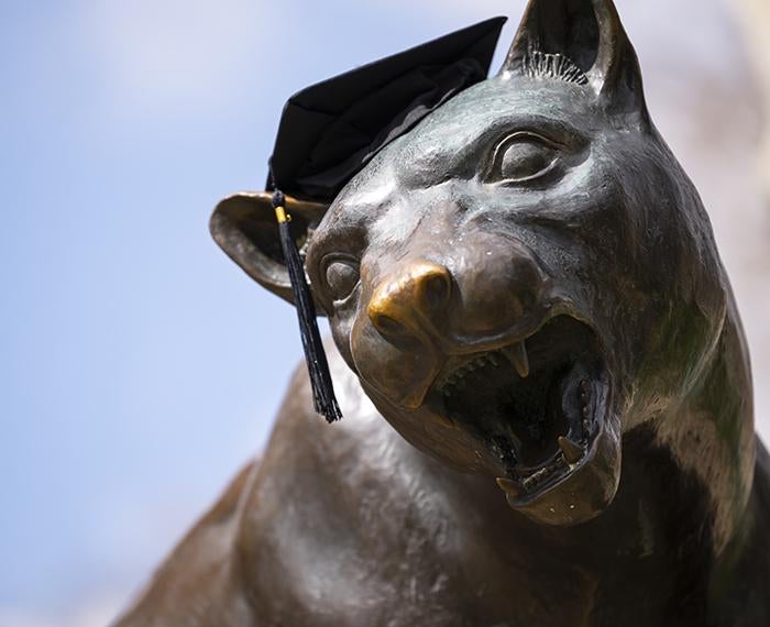 Pitt panther statue wearing graduation cap