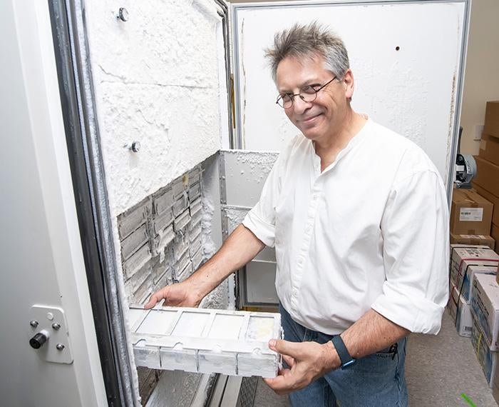 Graham Hatfull pulls samples from a freezer